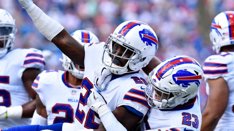 Sep 16, 2018; Orchard Park, NY, USA; Buffalo Bills defensive back Vontae Davis (22) and defensive back Micah Hyde (23) celebrate making a stop on third down during the first quarter against the Los Angeles Chargers at New Era Field. Mandatory Credit: Mark Konezny-USA TODAY Sports