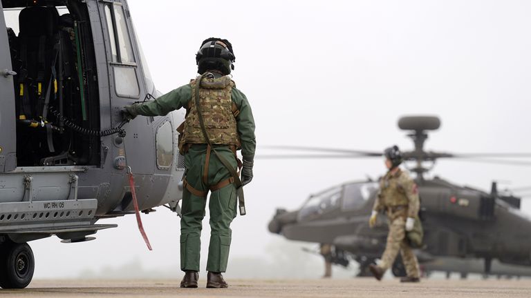 Pic: Joe Giddens/PA

A Wildcat reconnaissance helicopter (left) and a British Army Apache AH-64E attack helicopter (right) are prepared for take off from Wattisham Flying Station in Suffolk, before heading to Estonia to train alongside Nato allies on Exercise Steadfast Defender 24. 