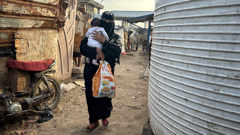 A woman and child inside the IDP camp