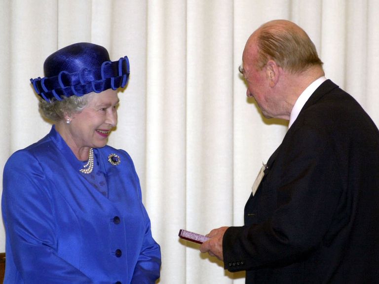 Queen Elizabeth presented Peter Higgs with a medal for his contribution to physics. Pic: PA