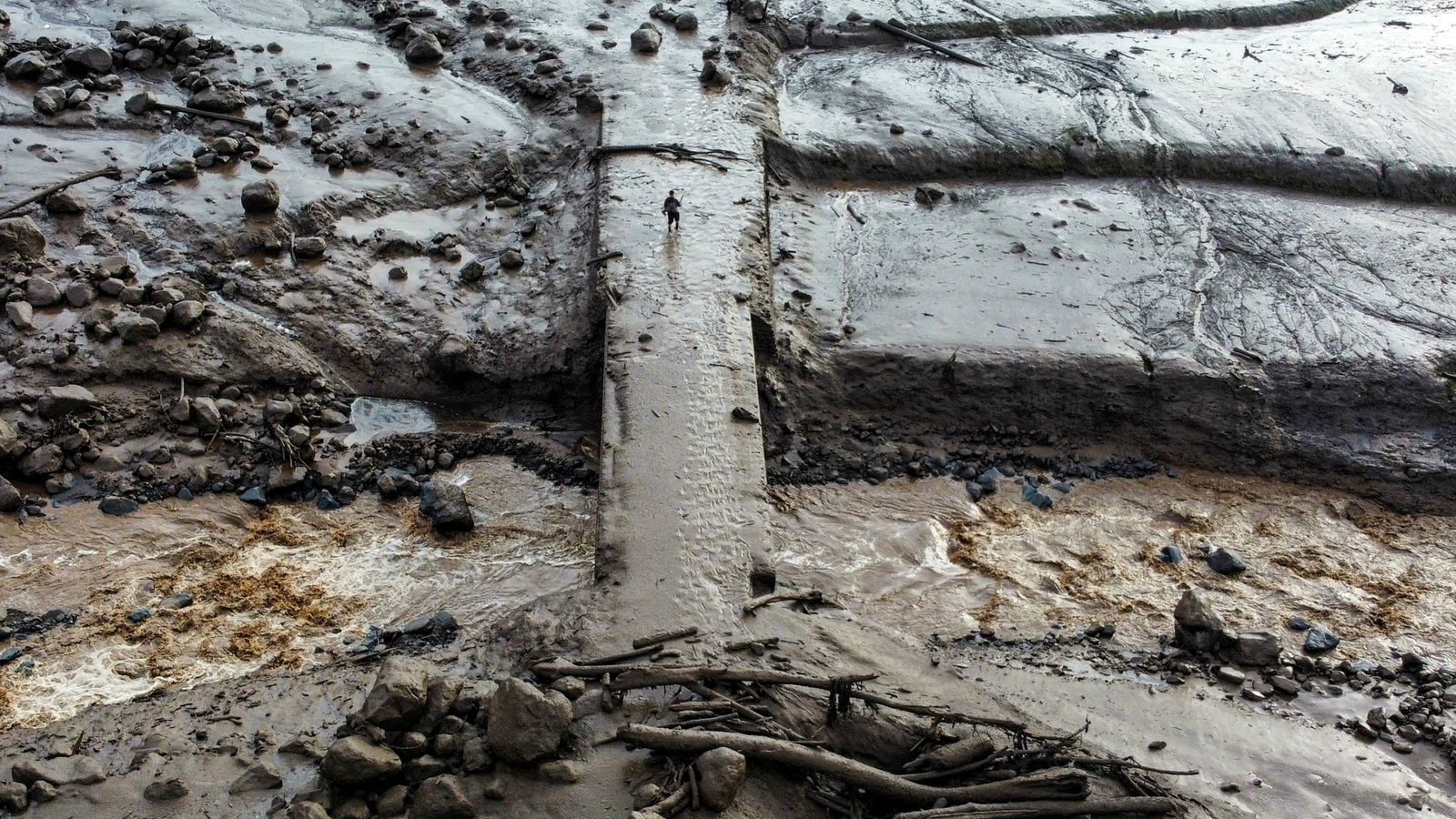 Cold lava landslides and flash floods leave 43 dead in Indonesia after