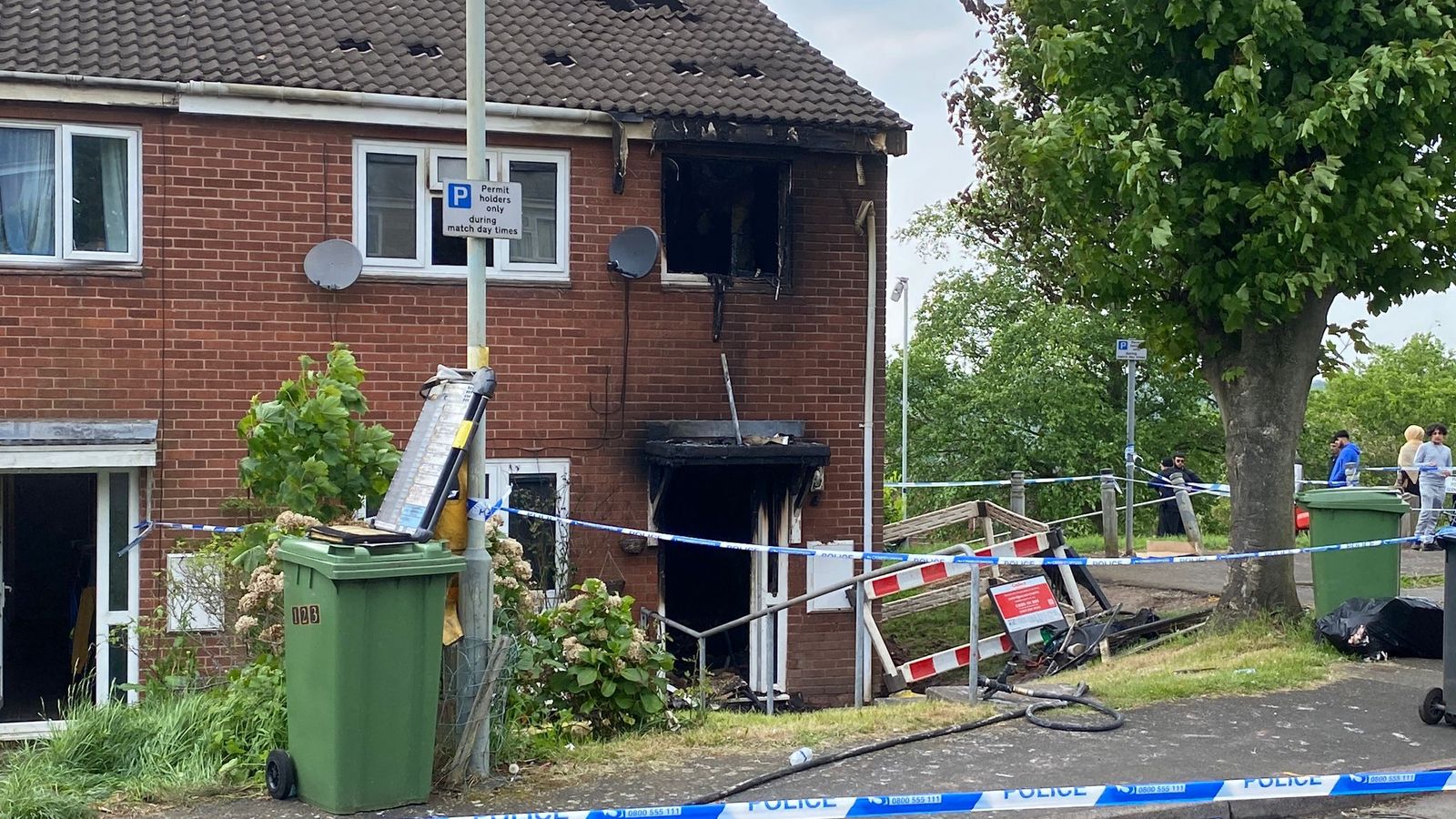 Two women killed in house fire - as two men held on suspicion of murder