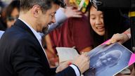 Actor Andy Serkis signs a photo of Gollum, his character in the Lord Of The Rings films. Pic: AP