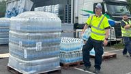 Bottled water being distributed in Paignton, Devon, after nearby residents were urged to boil their tap water for safety