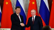 Xi Jinping and Vladimir Putin shaking hands last year. Pic: AP