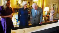 EMBARGOED TO 2200 THURSDAY MAY 2 King Charles III and Queen Camilla are presented with the Coronation Roll, an official record of their Coronation, by the Clerk of the Crown in Chancery, Antonia Romeo, at Buckingham Palace, central London. Picture date: Wednesday May 1, 2024.
