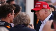 Former US President Donald Trump talks to race winner Lando Norris. Pic: Peter Casey/USA TODAY Sports/Reuters
