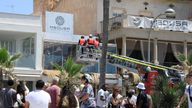 Firefighters at the Medusa Beach Club building after the deadly collapse. Pic: AP