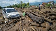 MANDATORY CREDIT.
A man stands near a damaged car in an area affected by heavy rain brought flash floods and landslides in Agam, West Sumatra province, Indonesia, May 12, 2024, in this photo taken by Antara Foto. Antara Foto/Iggo El Fitra/via REUTERS ATTENTION EDITORS - THIS IMAGE HAS BEEN SUPPLIED BY A THIRD PARTY. MANDATORY CREDIT. INDONESIA OUT. NO COMMERCIAL OR EDITORIAL SALES IN INDONESIA.