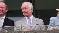 The King in the grandstand at Epsom. Pic: PA