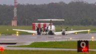 SEE STRICT NOTES BELOW - In this image taken from video, passengers alight after a light plane with three people aboard landed safely without landing gear at Newcastle Airport, Australia, Monday, May 13, 2024, after circling the airport for almost three hours to burn off fuel. The twin-turboprop Beechcraft Super King Air had just taken off from the airport north of Sydney for a flight to Port Macquarie when the pilot raised the alarm saying the landing gear had failed. (Channel 10 via AP)