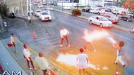 In this image taken from video provided by Jorge Toscano, a flame-swallower, right, and a group of guitar-toting mariachis fight, Sunday, May 19, 2024 in Morelia, Mexico. (Jorge Toscano via AP)