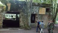 FILE - Tourists visit the ruins of Adolf Hitler&#39;s headquarters the "Wolf&#39;s Lair" in Gierloz, northeastern Poland, July 17, 2004 where his chief of staff members made an unsuccessful attempt at Hitler&#39;s life on July 20, 1944. Polish prosecutors have discontinued an investigation into human skeletons found at Wolf&#39;s Lair where German dictator Adolf Hitler and other Nazi leaders spent time during World War II because the advanced state of decay made it impossible to determine the cause of death, a spokesman said Monday, May 6, 2024.  (AP Photo/Czarek Sokolowski, File)