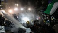 Police officers stand in front of demonstrators during a protest at UCLA.
Pic: Reuters