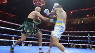 Tyson Fury lunges at Oleksandr Usyk. Pic: PA