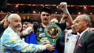 Oleksandr Usyk celebrates with the undisputed heavyweight title belt after his victory