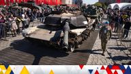 A Russian officer walks along a US-made M1 Abrams tank at an exhibition in Moscow of Western military equipment captured from Ukrainian forces. Pic: AP