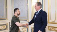In this photo provided by the Ukrainian Presidential Press Office, Ukrainian President Volodymyr Zelenskyy, left, shakes hands with Britain&#39;s Foreign Secretary David Cameron in Kyiv, Ukraine, Thursday, May 2, 2024. (Ukrainian Presidential Press Office via AP)