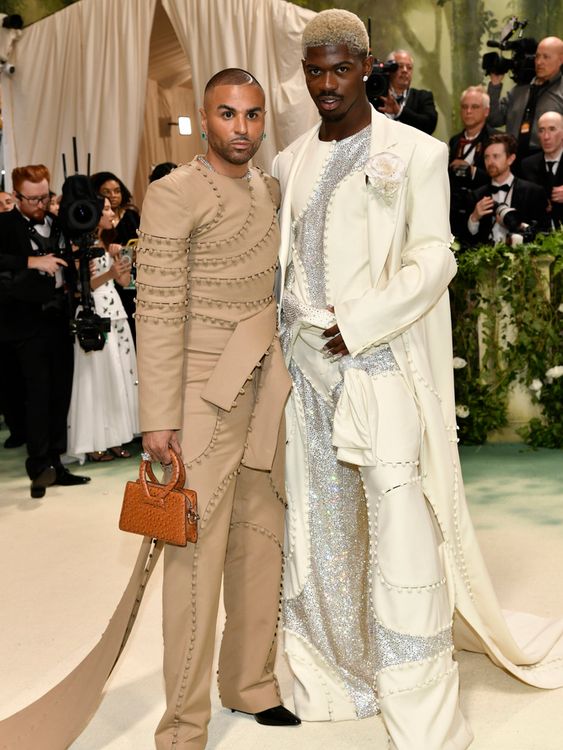 Raul Lopez, left, and Lil Nas X attend The Metropolitan Museum of Art&#39;s Costume Institute benefit gala celebrating the opening of the "Sleeping Beauties: Reawakening Fashion" exhibition on Monday, May 6, 2024, in New York. (Photo by Evan Agostini/Invision/AP)