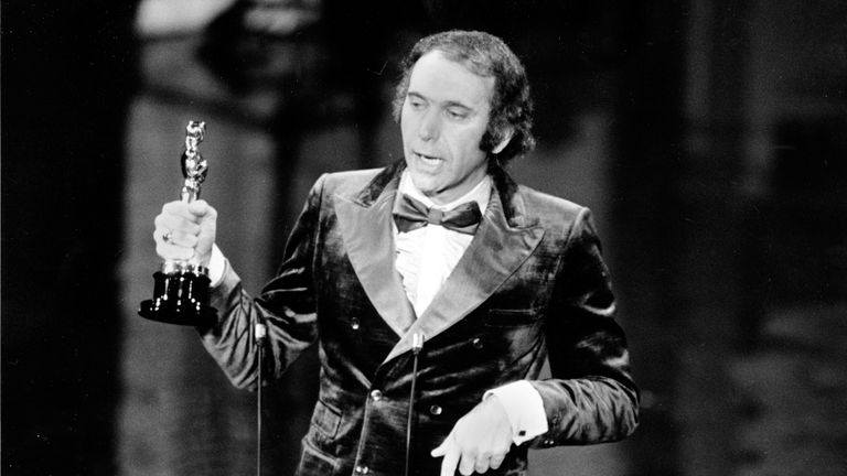 Producer Albert S. Ruddy holds his Oscar as he delivers his acceptance speech at the 45th annual Academy Awards ceremony in Los Angeles, California on March 27, 1973. Ruddy produced "The Godfather," which won the award for best film of the year.  (AP Photo)
