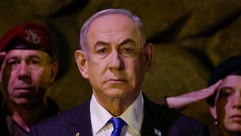 Israeli Prime Minister Benjamin Netanyahu, front, attends a wreath-laying ceremony marking Holocaust Remembrance Day in the Hall of Remembrance at Yad Vashem, the World Holocaust Remembrance Centre, in Jerusalem, Israel, Monday, May 6, 2024. (Amir Cohen/Pool Photo via AP)