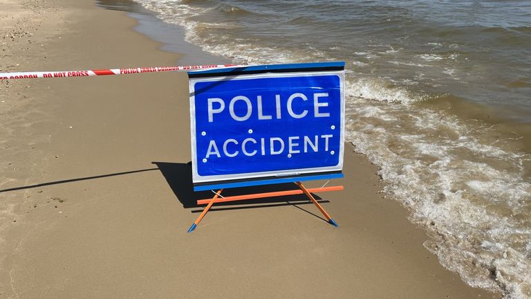 A police sign at the scene of the fatal stabbing at Durley Chine Beach in Bournemouth. Pic: PA

