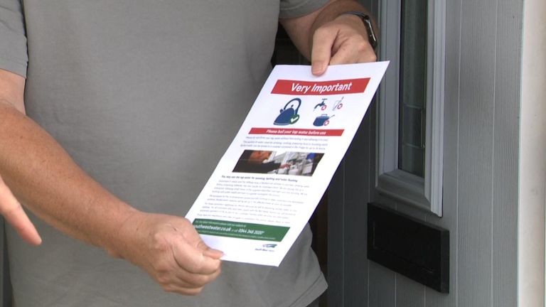 David Sneyd, a resident near the Brixham reservoir, showing Sky News a leaflet warning locals to boil their tap water.
