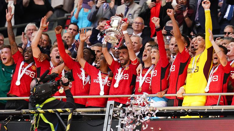 Manchester United&#39;s Bruno Fernandes lifts the FA Cup after the side won the Wembley final. Pic: PA