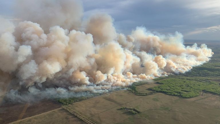 Smoke rises from mutual aid wildfire GCU007 in the Grande Prairie Forest Area near TeePee Creek, Alberta, Canada May 10, 2024. Alberta Wildfire/Handout via REUTERS THIS IMAGE HAS BEEN SUPPLIED BY A THIRD PARTY. NO RESALES. NO ARCHIVES
