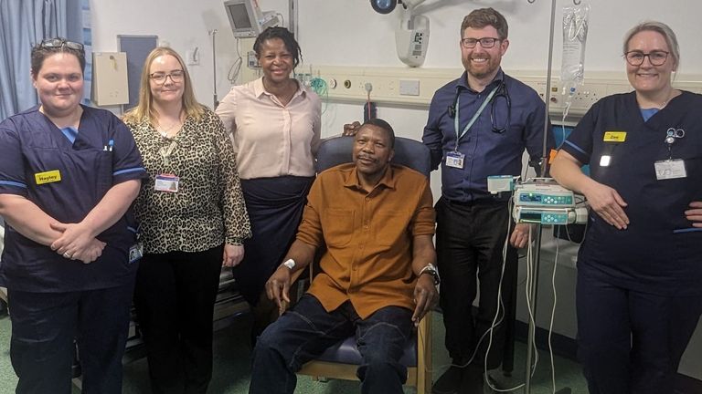 Undated handout photo issued by NHS England of Elliot Pfebve (centre), with (left to right) research sister Hayley Rolfe, colorectal cancer support worker Keely Holloway, oncology consultant Dr Victoria Kunene, oncology consultant Dr Mark Openshaw and research sister Zoe Haygarth. Mr Pfebve, 55, is the first patient in England to have been treated with a personalised vaccine for his bowel cancer, which was administered at Queen Elizabeth Hospital, Birmingham, and is designed to stimulate a patie