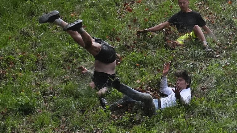 Pic: PA Participants take part in the annual cheese rolling at Cooper's Hill in Brockworth, Gloucestershire. Picture date: Monday May 27, 2024.