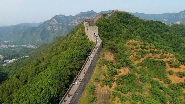 Runners react after taking part in China&#39;s Great Wall Marathon
