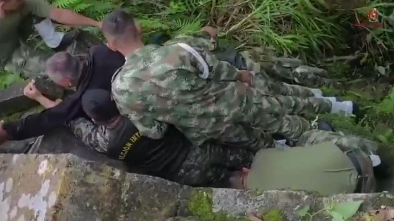 Soldiers rescue cyclist using makeshift ropes after he fell into a deep ravine 