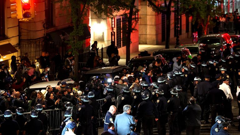 NYPD officers maintain a perimeter of closed streets around Columbia University Photo: Reuters