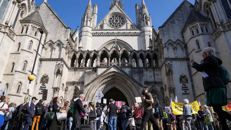 People attend a protest outside the High Court 
Pic: Reuters