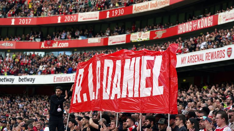 Fans hold up a banner on the 14th minute. Pic: PA/Adam Davy