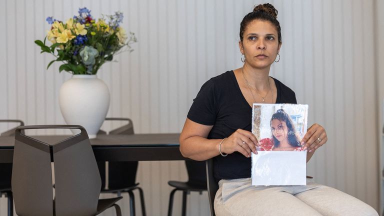 Orly Gilboa, the mother of hostage Daniela Gilboa, holding her daughter&#39;s picture. Pic: Reuters