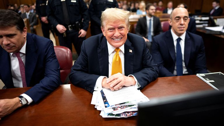 Donald Trump pictured grinning ahead of the judge giving final instructions to the jury. Pic: Reuters