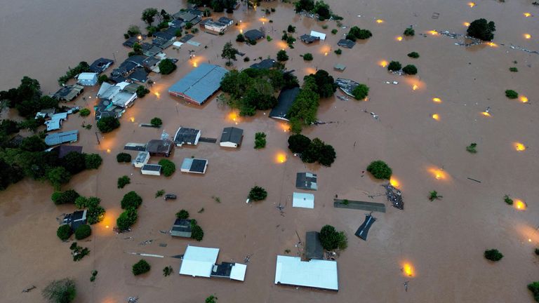 A drone view shows houses in the flooded area next to the Taquari River during heavy rains in the city of Encantado in Rio Grande do Sul, Brazil.
Pic: Reuters