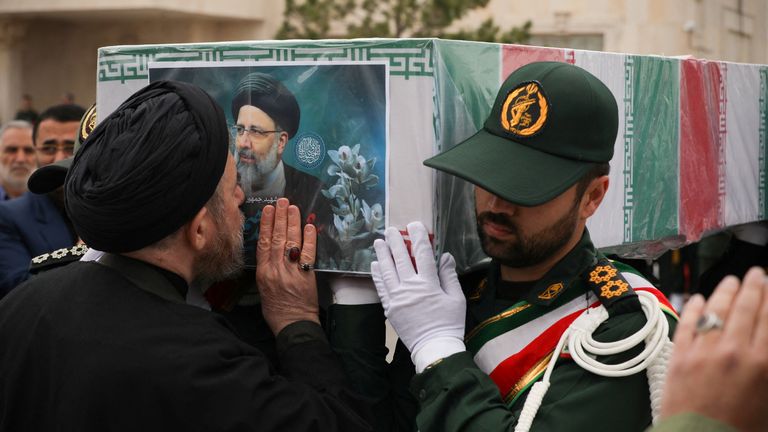 Soldiers carry the coffin of the late Iranian President Ebrahim Raisi, during his funeral ceremony in Tabriz.
Pic: WANA/Reuters