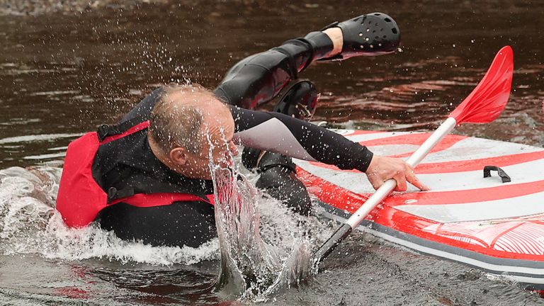 Pic: Reuters
British leader of the Liberal Democrats party Ed Davey falls from a paddle board, at Lake Windermere in Windermere, Britain, May 28, 2024. REUTERS/Phil Noble