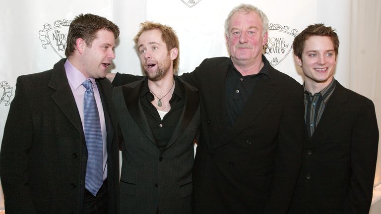 Actors (L to R) Sean Astin, Billy Boyd, Bernard Hill and Elijah Wood pose for photographers as they arrive at the National Board of Review of Motion Pictures 2003 annual awards gala in New York City, January 13, 2004. The group from the film "Lord of the Rings" and was presented the award for Best Acting by an Ensemble. REUTERS/Jeff Christensen PP04010037 JC