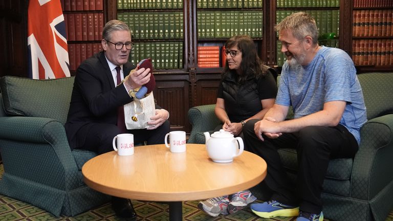Figen Murray, mother of Manchester Arena bombing victim Martyn Hett, and her husband Stuart speaking to Labour Party leader Keir Starmer.
Pic PA