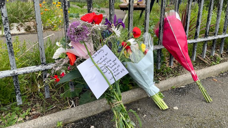 A member of a community garden in Wood Green  left flowers from the garden at Jacob's House. Pic: PA
