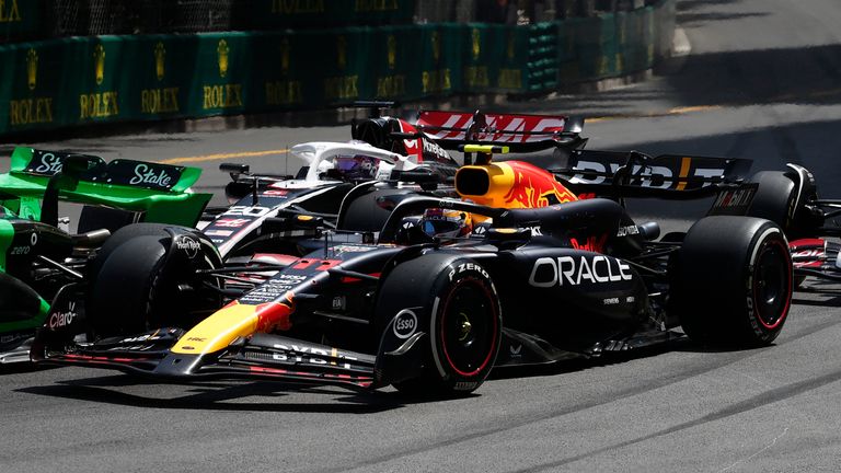 Formula One F1 - Monaco Grand Prix - Circuit de Monaco, Monaco - May 26, 2024 Haas&#39; Kevin Magnussen and Red Bull&#39;s Sergio Perez in action at the start of the race REUTERS/Benoit Tessier