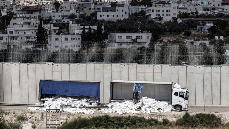 13 May 2024, Israel, Shekef: A general view of vandalized and abandoned humanitarian aid trucks at the separation wall, which were on their way to the Gaza Strip. Photo by: Ilia Yefimovich/picture-alliance/dpa/AP Images