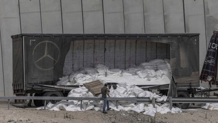 13 May 2024, Israel, Shekef: A general view of vandalized and abandoned humanitarian aid trucks at the separation wall, which were on their way to the Gaza Strip. Photo by: Ilia Yefimovich/picture-alliance/dpa/AP Images