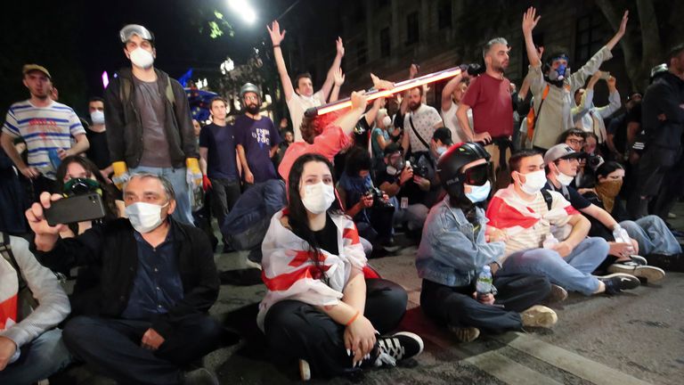 Demonstrators sit in protest. Pic: AP