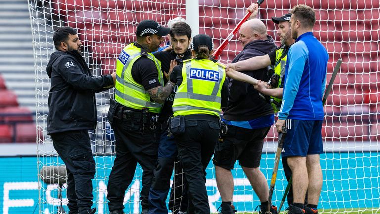 Protester locks himself to the goal post in protest against Israel during the Euro qualifiers between Scotland and Israel at Hampden Park on May 31, 2024 in Glasgow, Scotland.  Photo: SNS Group