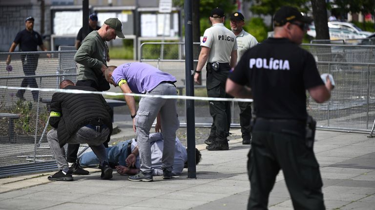 Pic: AP
Police arrest a man after Slovak Prime Minister Robert Fico was shot and injured following the cabinet&#39;s away-from-home session in the town of Handlova, Slovakia, Wednesday, May 15, 2024.  Fico is in life-threatening condition after being wounded in a shooting Wednesday afternoon, according to his Facebook profile. (Radovan Stoklasa/TASR via AP)